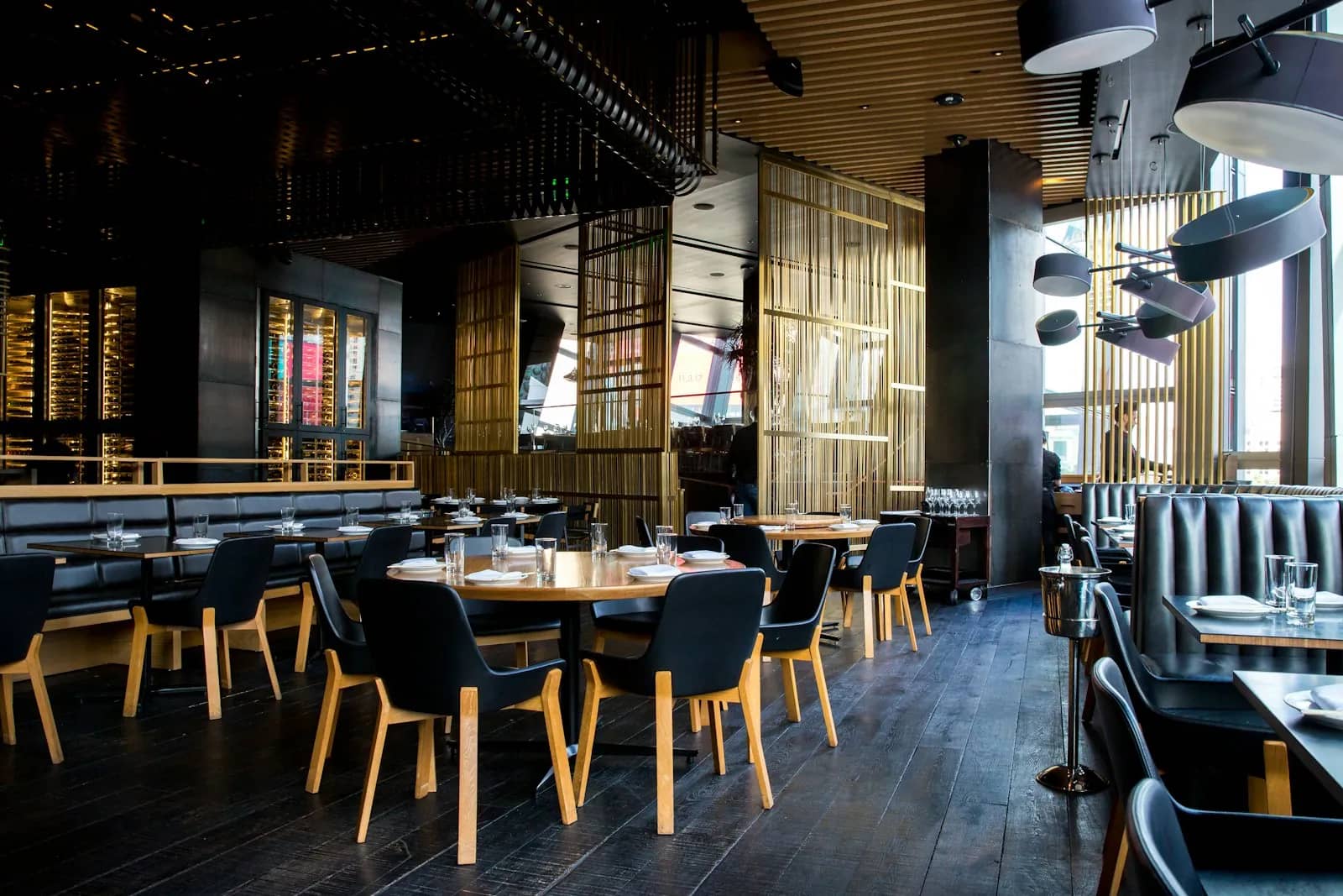 Warm restaurant interior with set tables